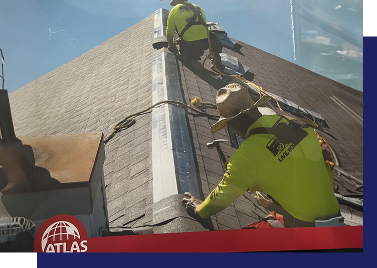 Two men working on a roof with safety gear.